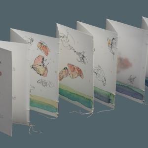 Accordian folding zine with watercolor illustrations of monarch butterflies