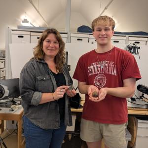 Andrew Francois and curator at Jamestown Rediscovery holding 3D models of artifacts.