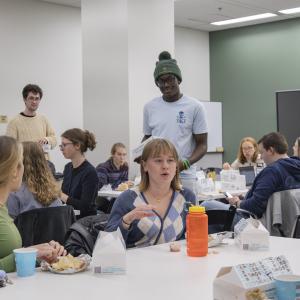 Students talking during dinner time at Honors Thesis Retreat