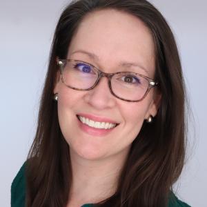 Meghan Bryant looking at the camera and smiling.